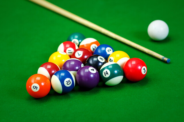 Billiard balls in a green pool table, game